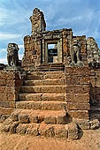 Angkor - Eastern Mebon - towered passageways leading to the first enclosure of the temple,  with stone lions guarding the entrance.